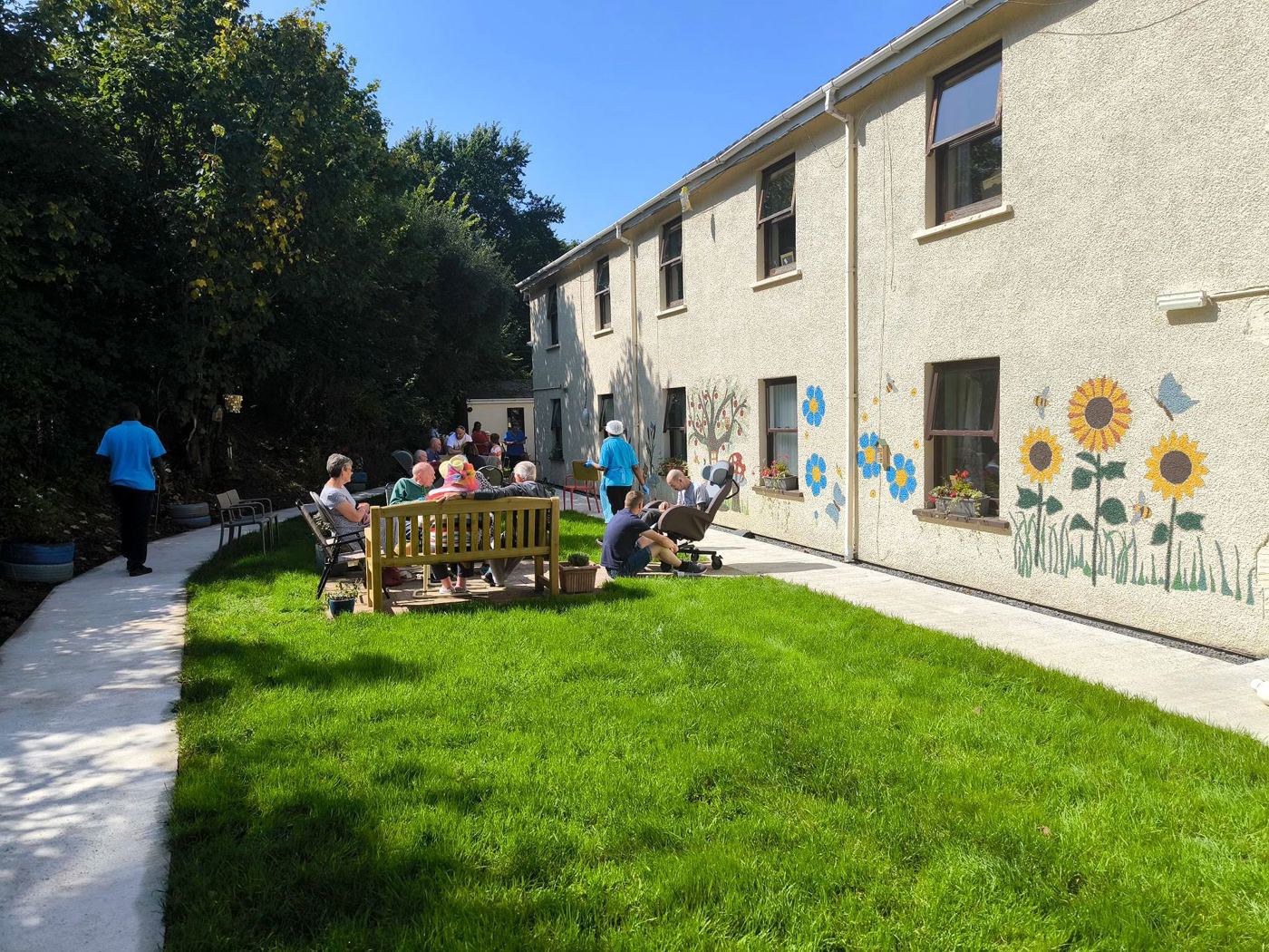 A resident gardening in the grounds at Rickeston Mill